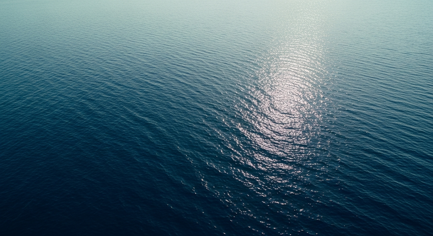 Calm sunlit ocean surface